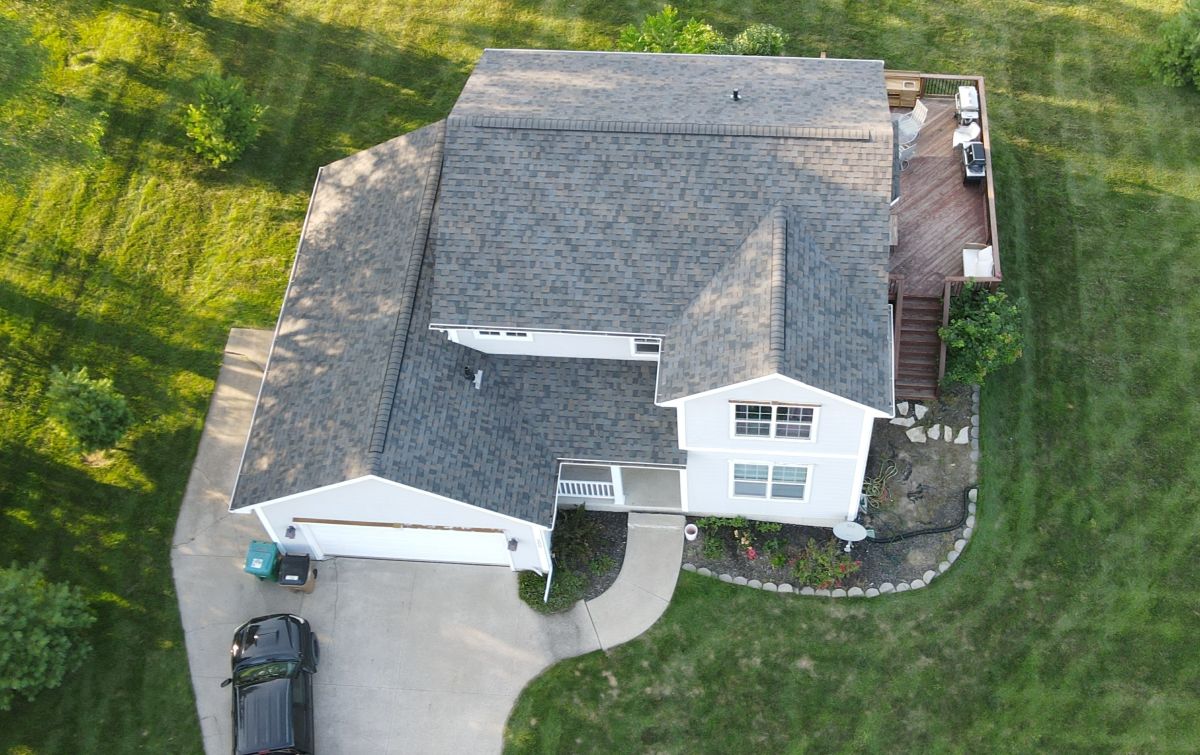 Grey shingle roof on a large house